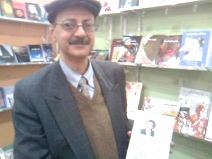 home-biz-trends.com/phoenix-order.html - Phoenix Order: Elhami Lutfi the owner of Alhadarah Printing in Cairo Book Fair with a copy of Rising of the Phoenix by Sudanese poet Khalid Mohammed Osman.